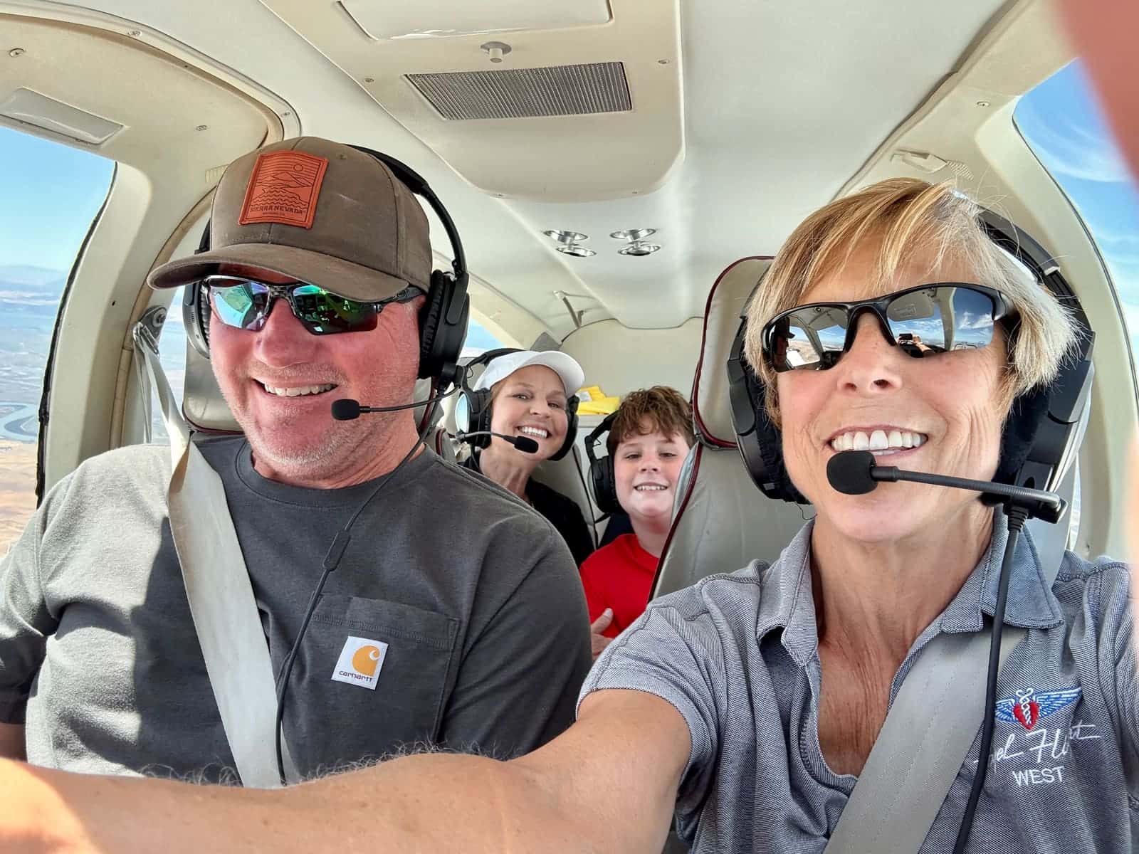 Angel Flight West passengers and pilots on the tarmac