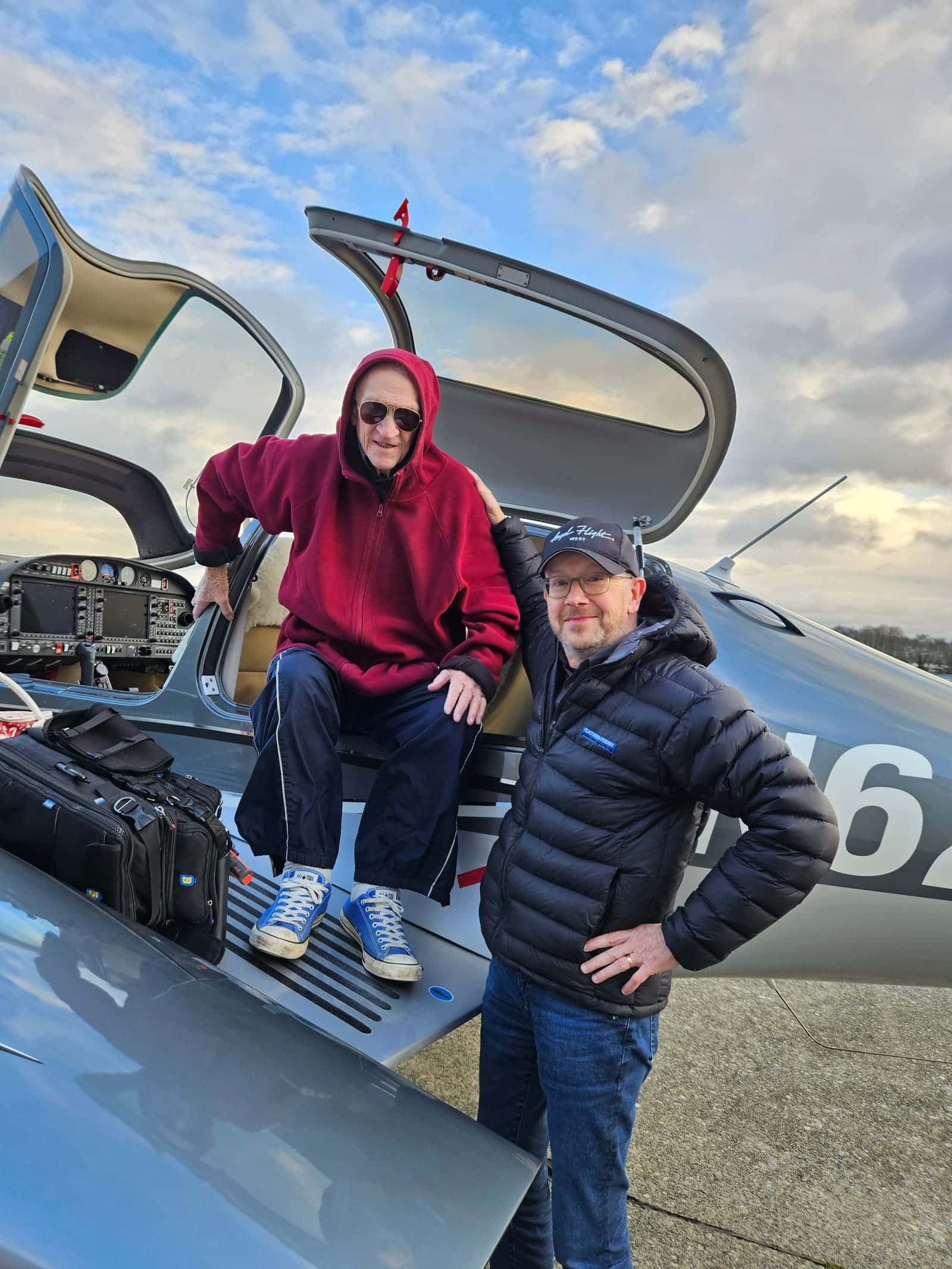 Patients and volunteer pilots celebrating a completed mission