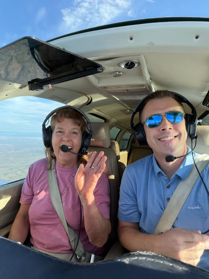 Dustin Bray and an Angel Flight West passenger in an aircraft cockpit